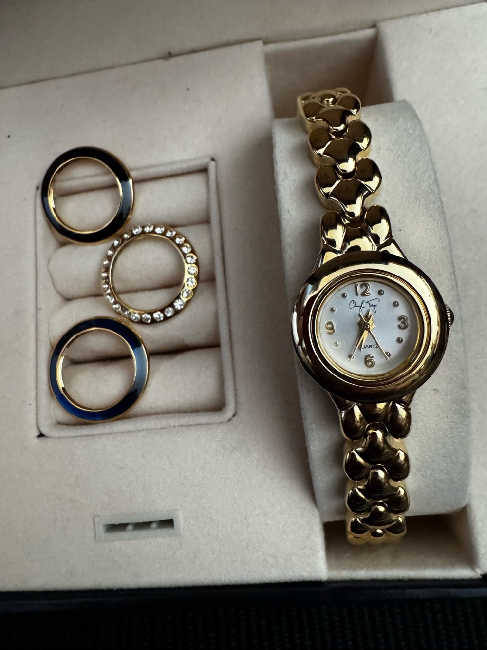 Rare Cheryl Tiegs boxed gold watch with 4 interchangeable bezels. From the 1980s